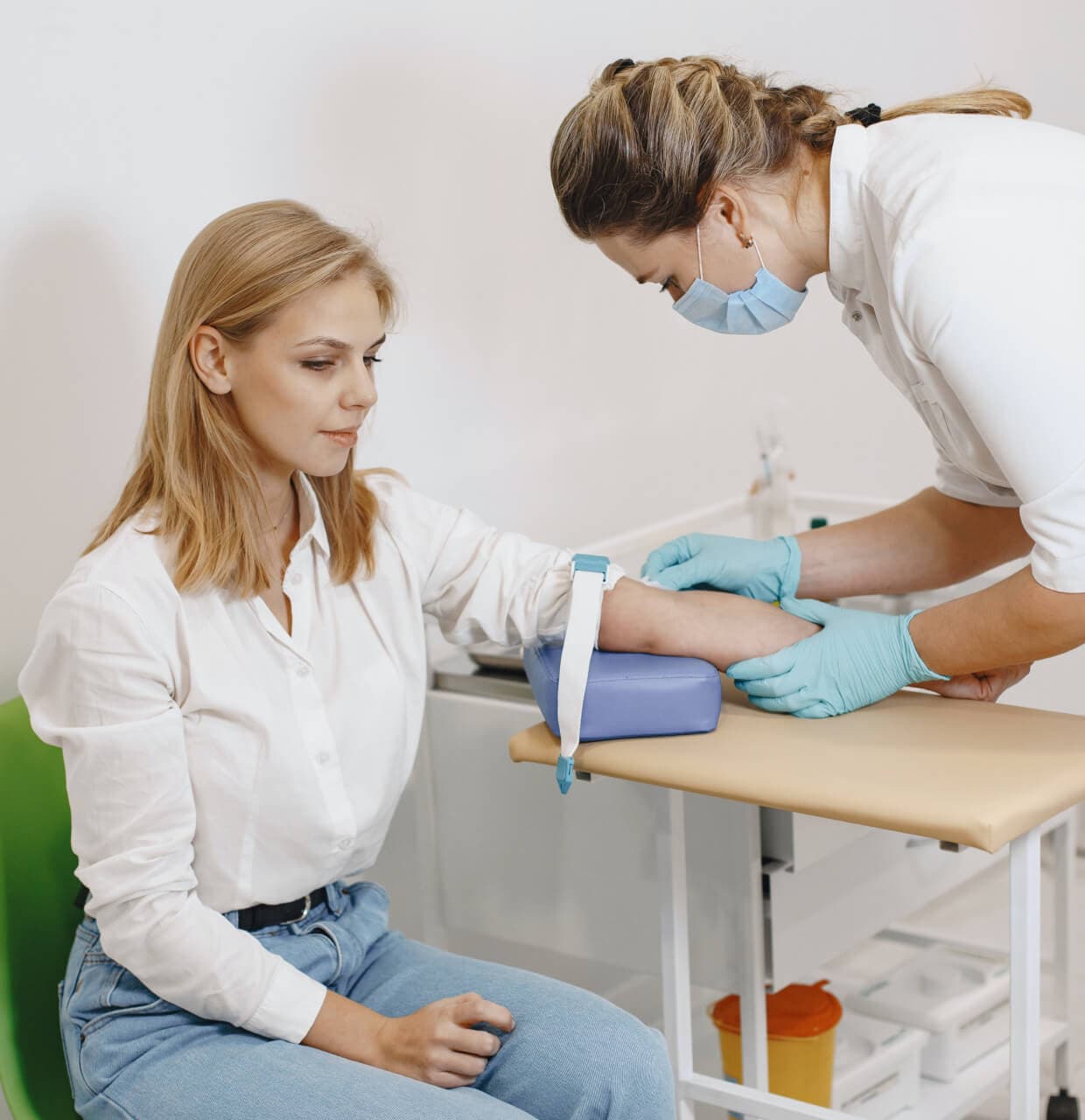 A nurse checking a patient